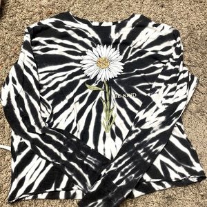 I only wore it a handful of times. It is a cropped long sleeve.